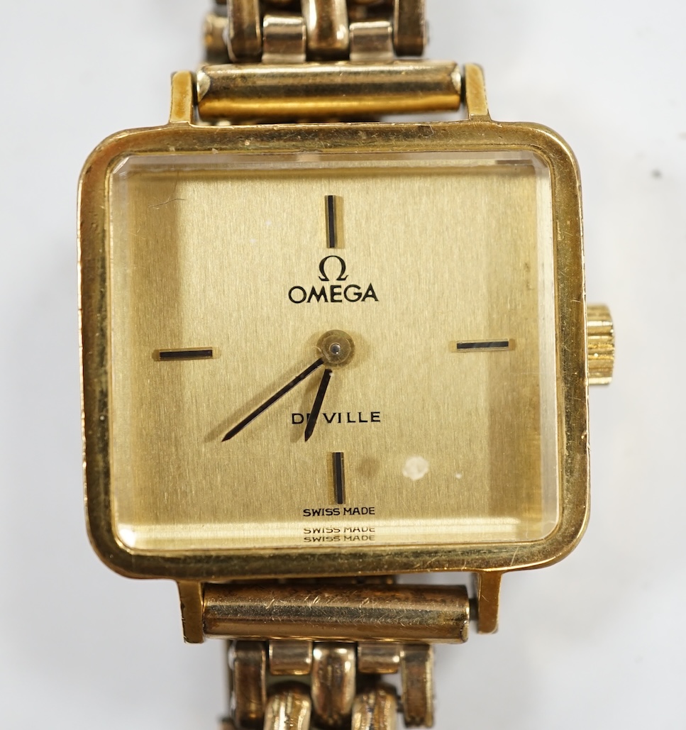 A lady's steel and gold plated Omega De Ville manual wind wrist watch, on an associated gold plated bracelet. Condition - poor to fair